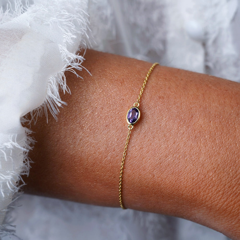 Armband med februari månadssten Ametist. Guldarmband med lila kristall Ametist.